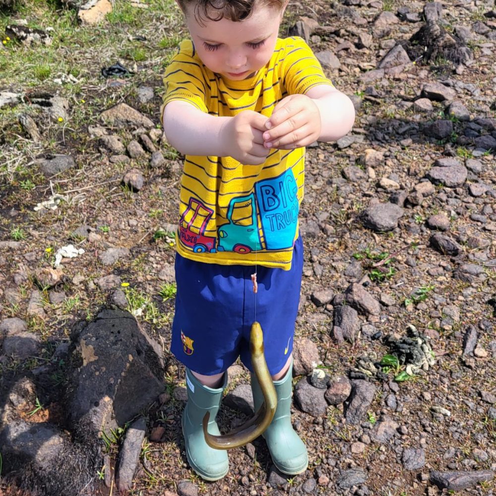3 year old Innes Graham with an eel