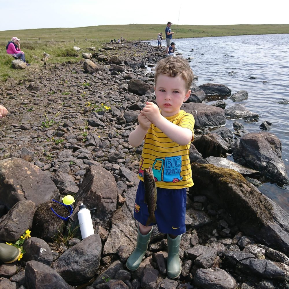 3 year old Innes Graham with his first trout